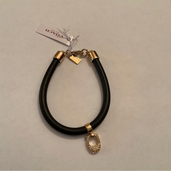 Coach NWT leather bracelet with charm